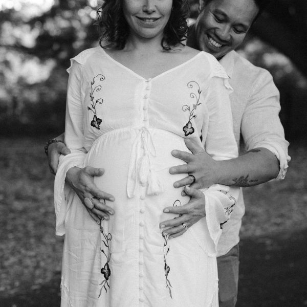 lovely shot of pregnant bride and proud father