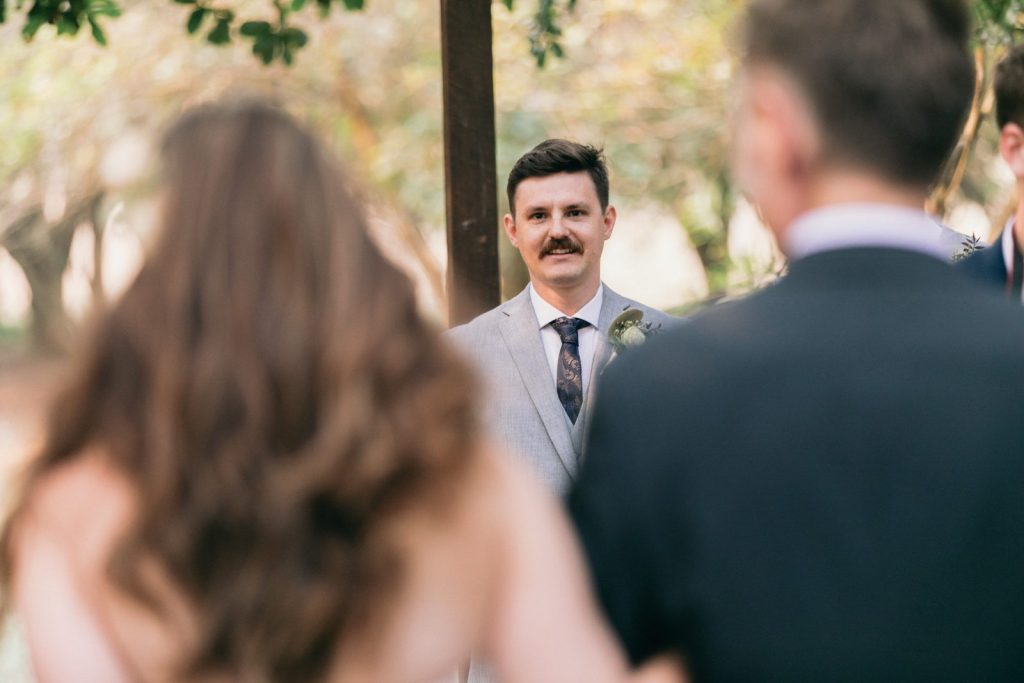 Bride walking to groom